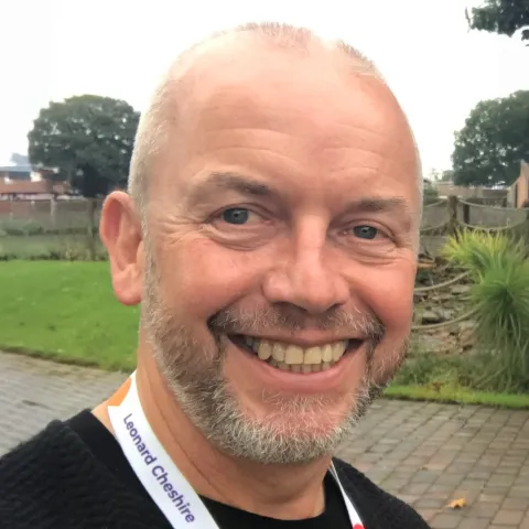 Dave Hursthouse, PAAT director, smiling outdoors